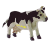 Une peluche de vache, brodée "Ciboulette" sur le ventre, posée sur le bureau